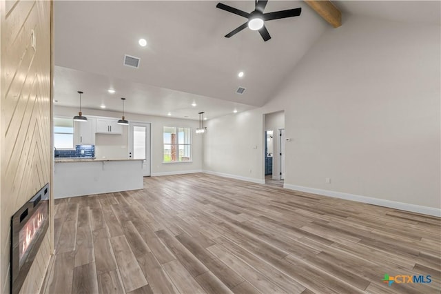 1811 Ember Dr, Temple, TX 76502 - unfurnished living room with ceiling fan, beamed ceiling, light wood-style flooring, recessed lighting, and high vaulted ceiling