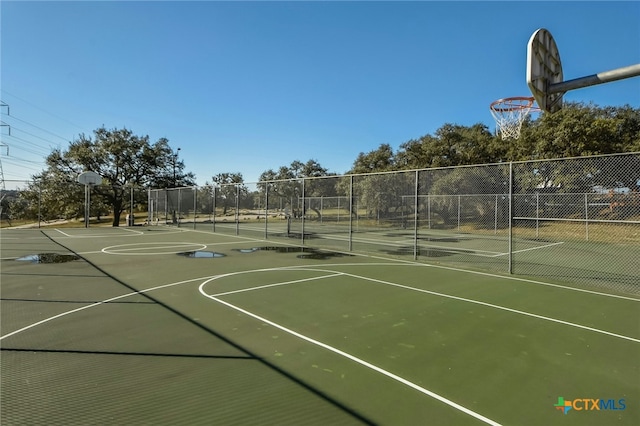 view of sport court with community basketball court and fence