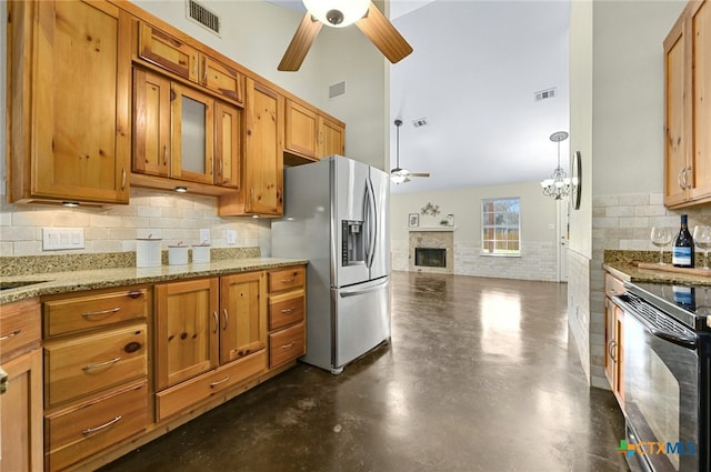 kitchen featuring a ceiling fan, black range with electric cooktop, stainless steel fridge, and visible vents