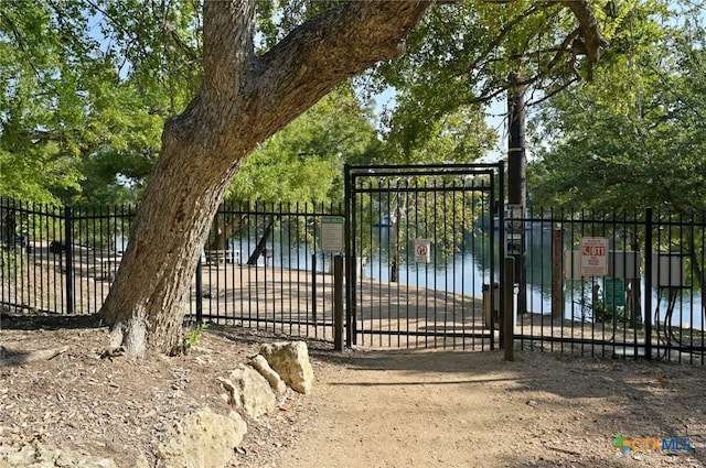 view of gate featuring fence