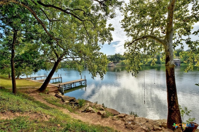 dock area featuring a water view