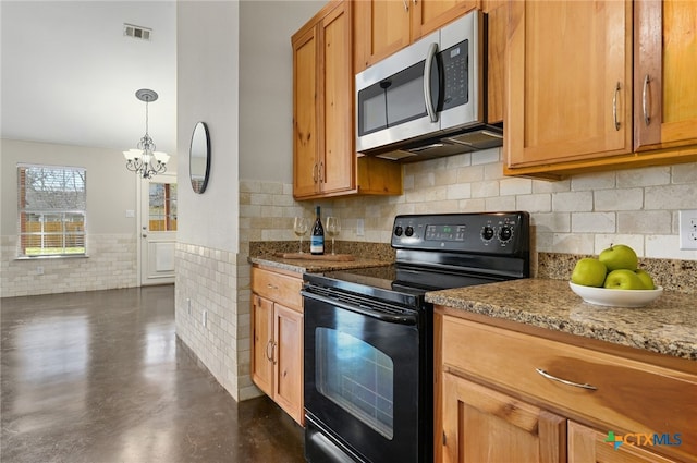 kitchen with stainless steel microwave, visible vents, black electric range, brown cabinetry, and finished concrete floors