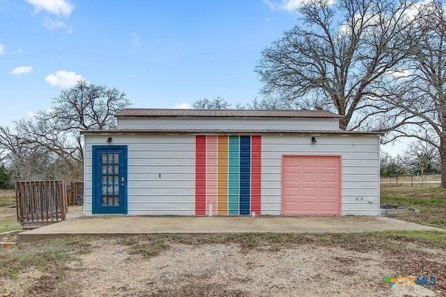 garage with fence