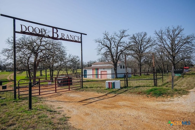 exterior space with a gated entry, driveway, and a gate