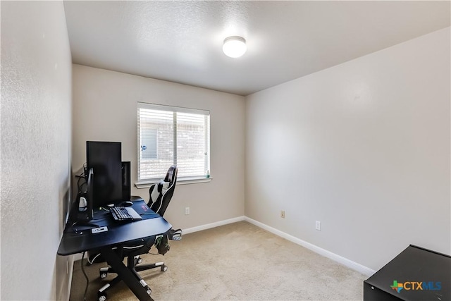 office space with baseboards and carpet floors