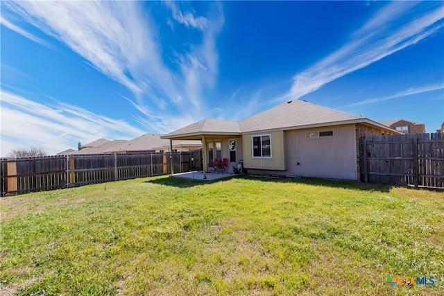 back of property featuring a patio area, a lawn, a fenced backyard, and stucco siding