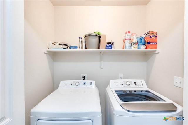 laundry room with laundry area and separate washer and dryer