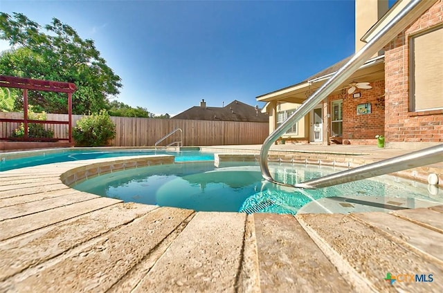 view of pool featuring a patio