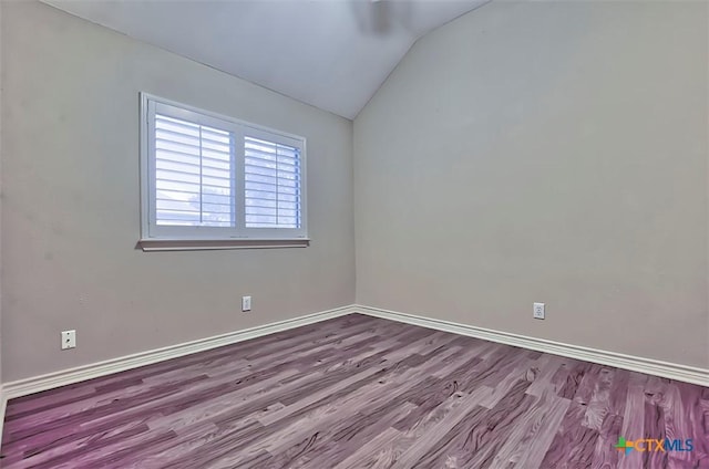 unfurnished room featuring vaulted ceiling and light hardwood / wood-style floors