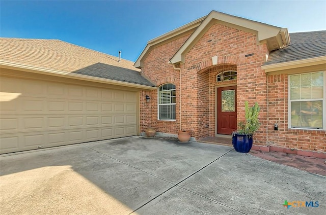 view of front of property with a garage