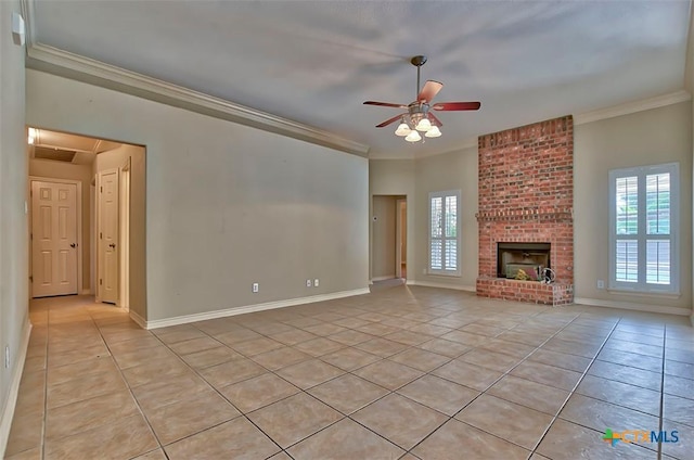 unfurnished living room with ceiling fan, ornamental molding, and light tile patterned flooring