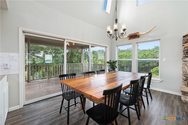 514 Eden Ranch Dr, Canyon Lake, TX 78133 - dining space with a chandelier, healthy amount of natural light, a towering ceiling, and dark wood finished floors