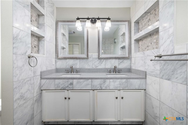 514 Eden Ranch Dr, Canyon Lake, TX 78133 - full bathroom with tile walls and double vanity