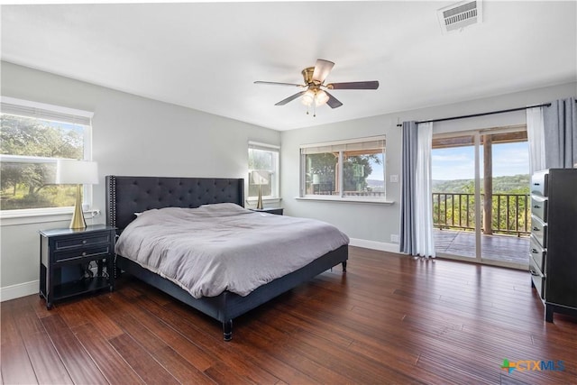 514 Eden Ranch Dr, Canyon Lake, TX 78133 - bedroom featuring multiple windows, access to exterior, wood finished floors, and a ceiling fan
