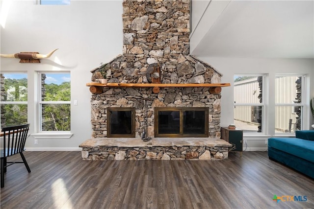 514 Eden Ranch Dr, Canyon Lake, TX 78133 - living area with a stone fireplace and wood finished floors