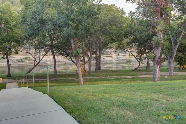 540 River Run Unit 204, New Braunfels, TX 78132 - surrounding community with a yard and a water view