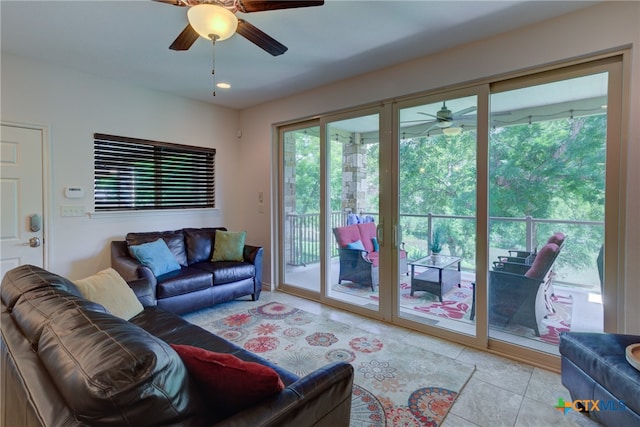 living room featuring ceiling fan and light tile patterned floors