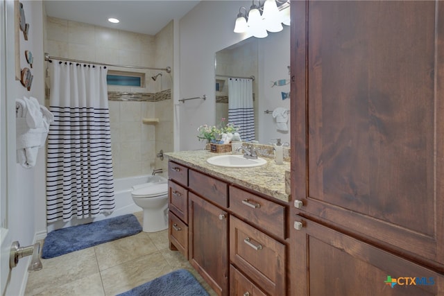 full bathroom with shower / tub combo, an inviting chandelier, vanity, tile patterned floors, and toilet