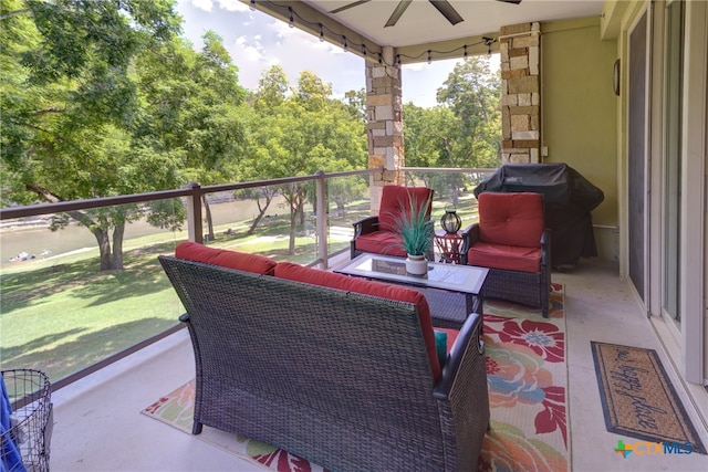 view of patio featuring grilling area, ceiling fan, and a balcony