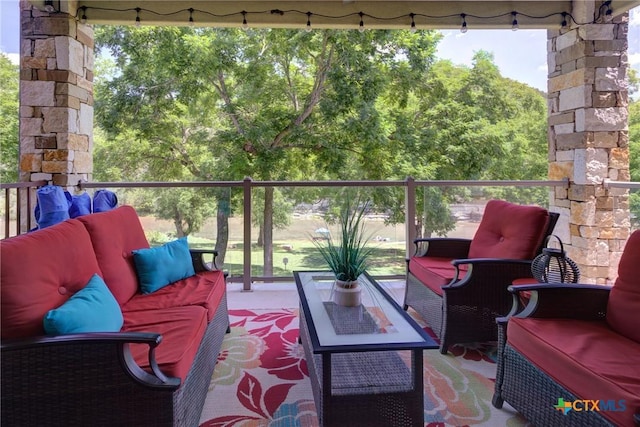 540 River Run Unit 204, New Braunfels, TX 78132 - balcony with an outdoor living space and a wooded view