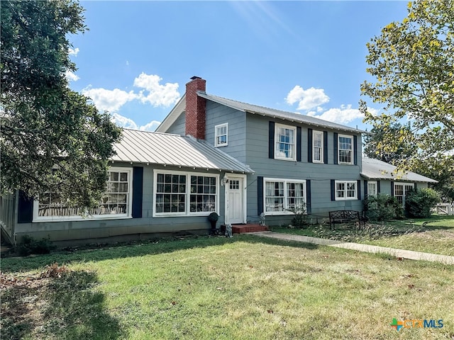 view of front of property with a front lawn