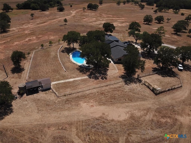 birds eye view of property with a rural view