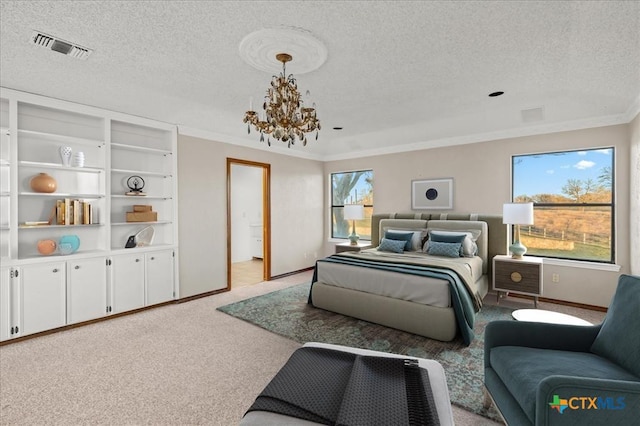 bedroom featuring multiple windows, a textured ceiling, and a notable chandelier