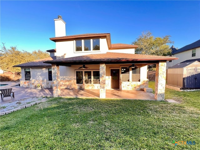 back of property featuring a patio, a yard, and ceiling fan