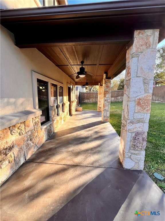 view of patio / terrace featuring ceiling fan