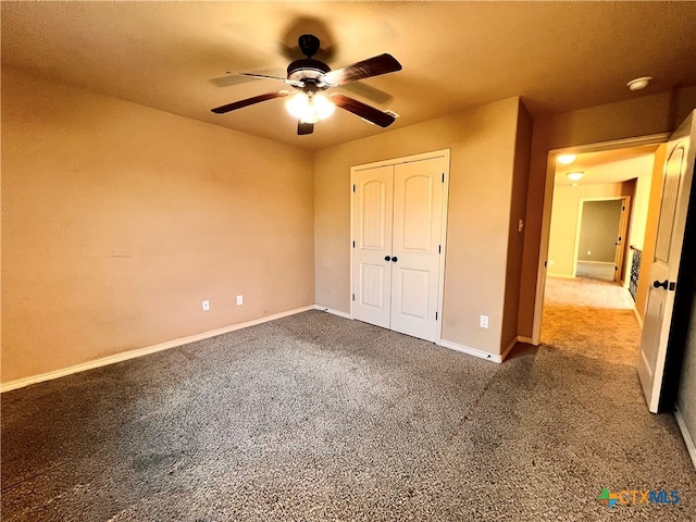 unfurnished bedroom featuring ceiling fan, a closet, and carpet