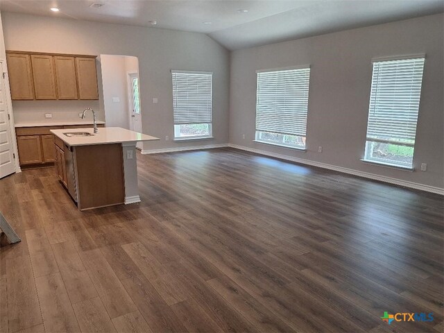 504 Story Ave, Florence, TX 76527 - kitchen with open floor plan, light countertops, dark wood-style flooring, a kitchen island with sink, and plenty of natural light