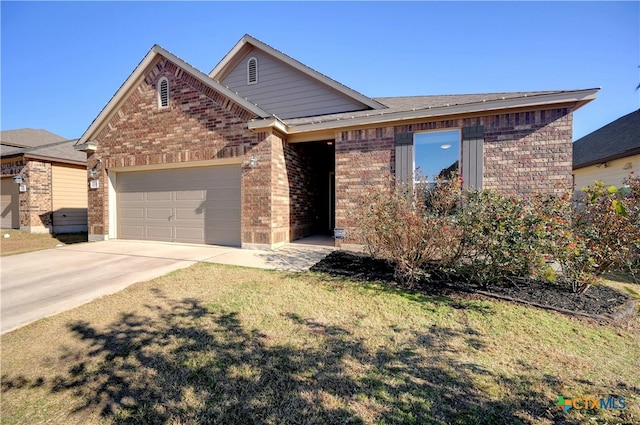 view of front of house featuring a garage and a front yard