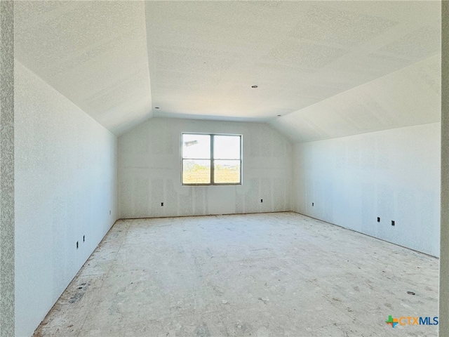 bonus room with vaulted ceiling