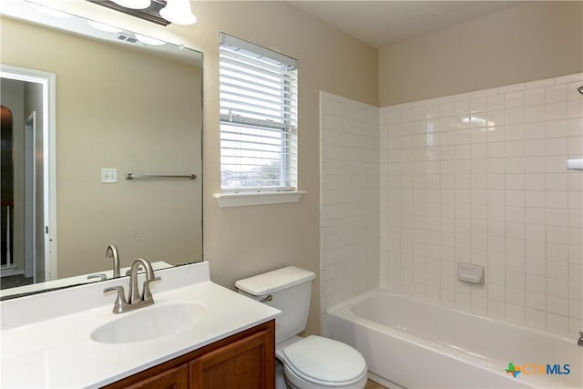 full bath featuring visible vents, vanity, toilet, and tub / shower combination