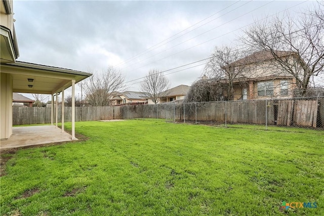 view of yard with a fenced backyard and a patio