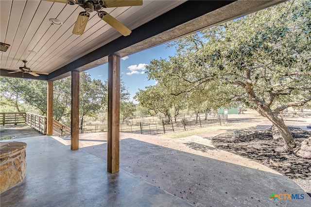 view of patio featuring ceiling fan