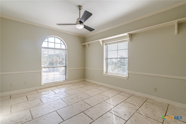 unfurnished room featuring ceiling fan and crown molding