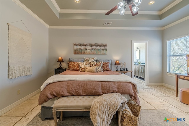 bedroom with a tray ceiling, ceiling fan, and ornamental molding