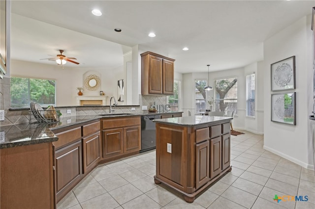 407 Misty Morn Ln, Cedar Park, TX 78613 - kitchen featuring dishwasher, a sink, light tile patterned floors, and tasteful backsplash