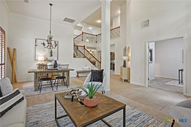 407 Misty Morn Ln, Cedar Park, TX 78613 - living room with a high ceiling, stairs, visible vents, and baseboards