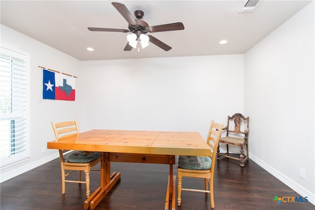 dining room featuring dark hardwood / wood-style floors and ceiling fan