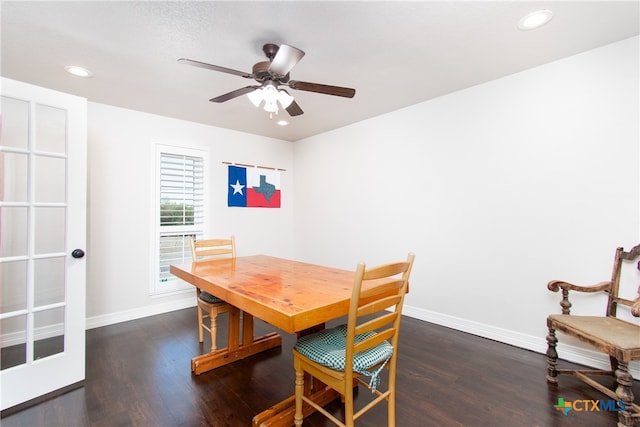 dining area with dark wood-type flooring and ceiling fan