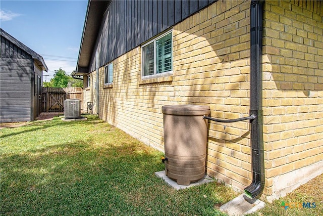 4101 Hickory Rd, Temple, TX 76502 - view of side of property with brick siding and central air condition unit