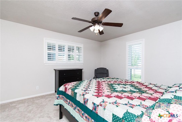 4101 Hickory Rd, Temple, TX 76502 - carpeted bedroom with baseboards, a ceiling fan, and a textured ceiling