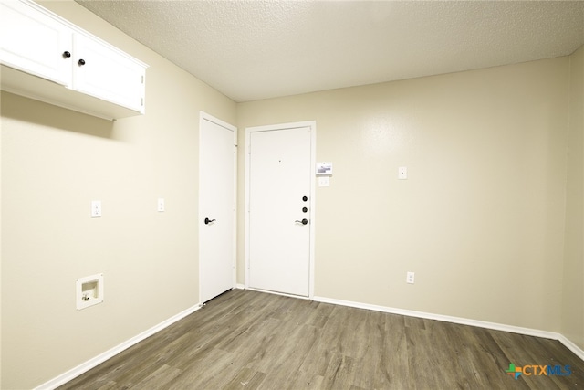 4408 Secretariat Dr, Killeen, TX 76549 - washroom with cabinet space, wood finished floors, baseboards, washer hookup, and a textured ceiling