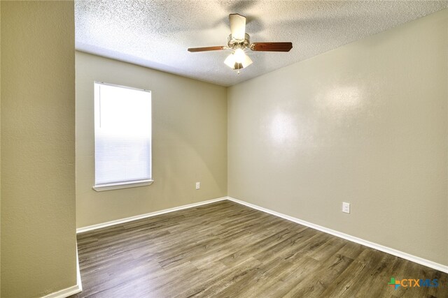 4408 Secretariat Dr, Killeen, TX 76549 - spare room with wood finished floors, a ceiling fan, baseboards, and a textured ceiling