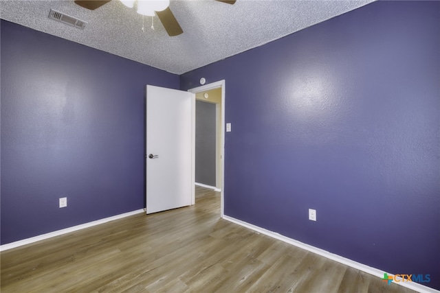 4408 Secretariat Dr, Killeen, TX 76549 - unfurnished room featuring a ceiling fan, wood finished floors, baseboards, and a textured ceiling