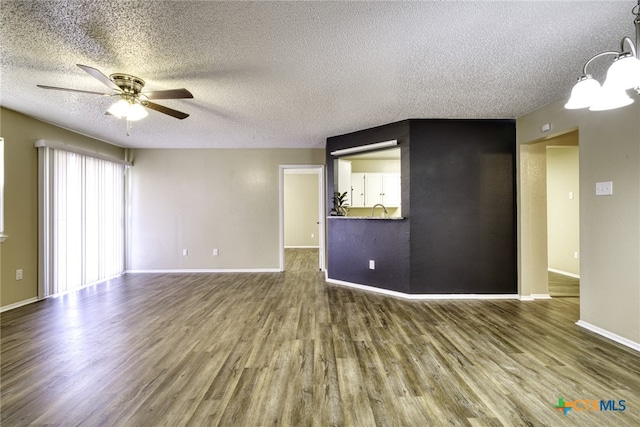 4408 Secretariat Dr, Killeen, TX 76549 - unfurnished room with ceiling fan, wood finished floors, a textured ceiling, a sink, and baseboards