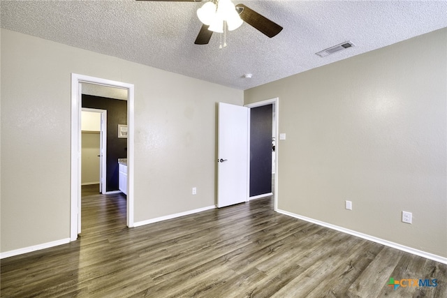 4408 Secretariat Dr, Killeen, TX 76549 - spare room with dark wood-type flooring, ceiling fan, a textured ceiling, and baseboards