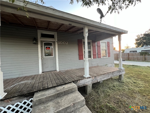 property entrance with a yard